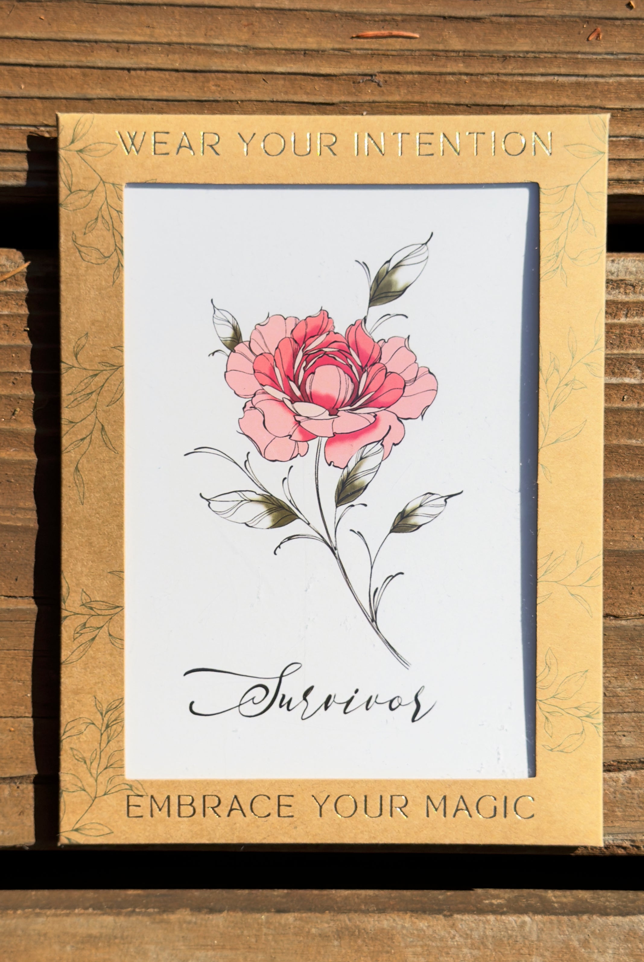 "Survivor" Peony flower temporary tattoo in packaging.