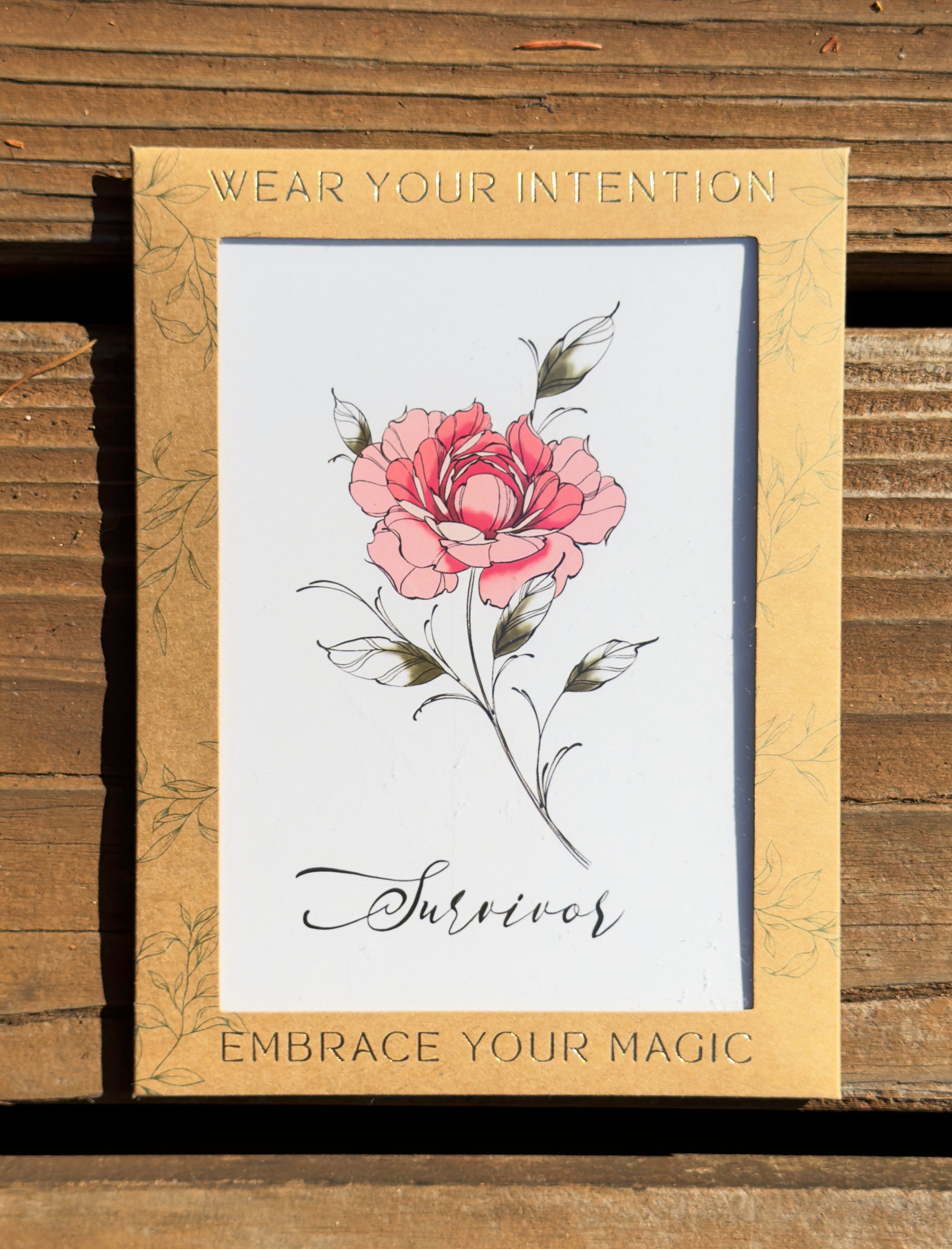 "Survivor" Peony flower temporary tattoo in packaging.