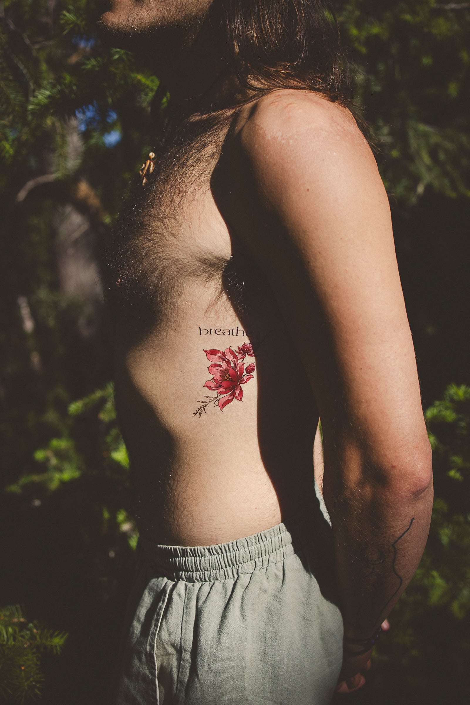 Close-up of "Breathe" temporary tattoo on hand, promoting presence